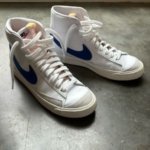 Nike Blazers size 8.5 with blue swoosh.